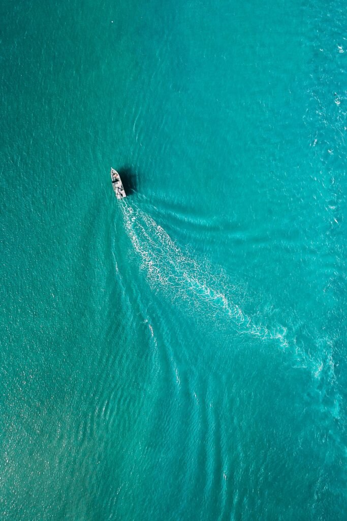 Drone view of yacht sailing in sea water