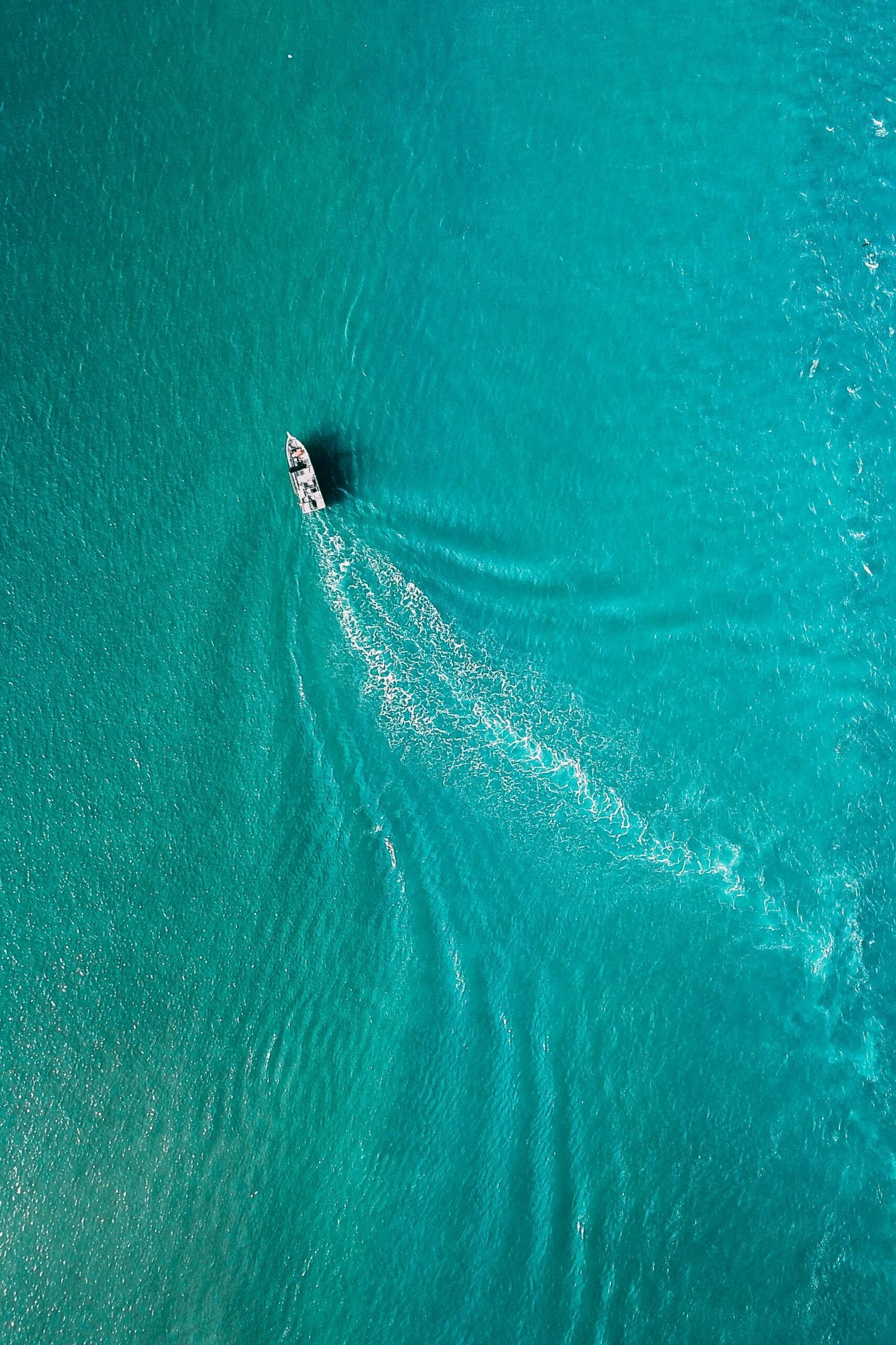 Drone view of yacht sailing in sea water